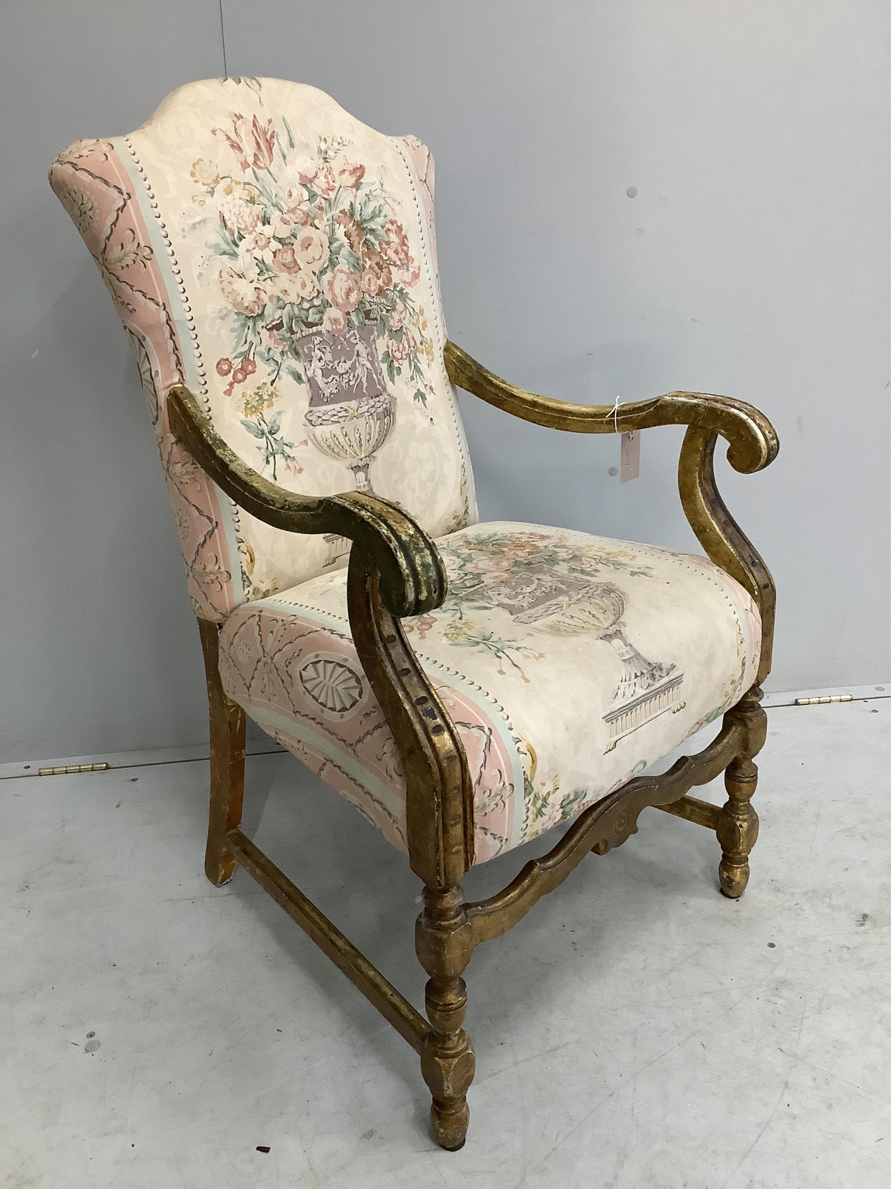 A French giltwood and tapestry open armchair, width 58cm, depth 56cm, height 102cm. Condition - fair to good